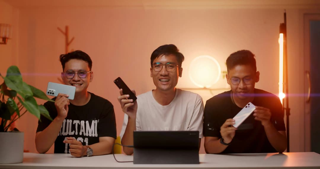 3 men with their phones